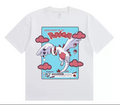 White t-shirt with a Pokémon graphic featuring a character and clouds on a blue background.
